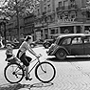 Photo: Cycling down the Champs-Elysees, Paris, 1950