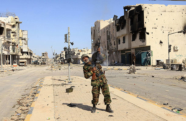 Anti-Gaddafi fighters celebrate the fall of Sirte (Pic: Reuters)