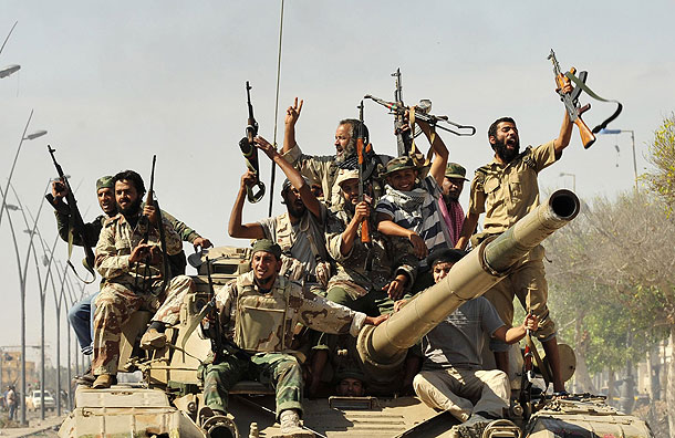Anti-Gaddafi fighters celebrate the fall of Sirte (Pic: Reuters)