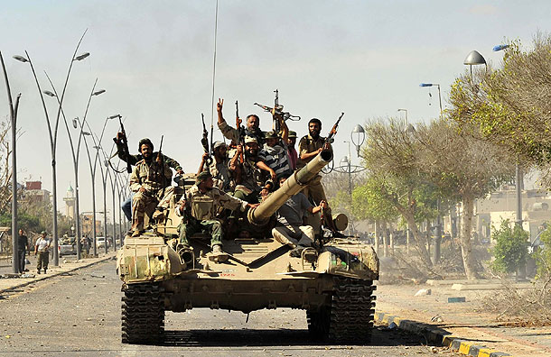 Anti-Gaddafi fighters celebrate the fall of Sirte (Pic: Reuters)