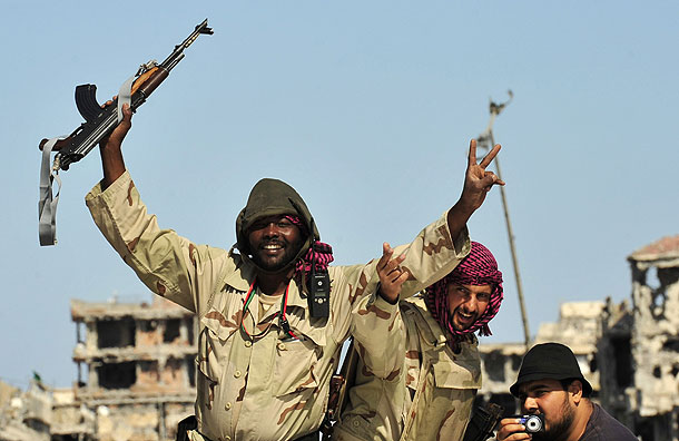 Anti-Gaddafi fighters celebrate the fall of Sirte (Pic: Reuters)