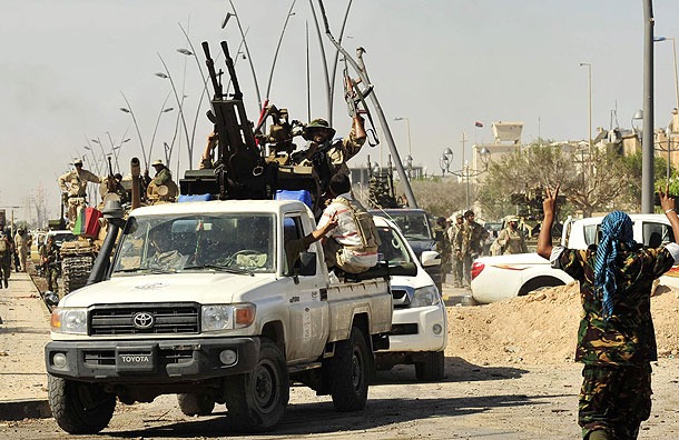 Anti-Gaddafi fighters celebrate the fall of Sirte (Pic: Reuters)