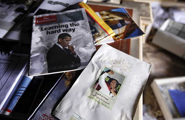 Image of deposed Libyan leader Colonel Gaddafi sits next to a copy of the magazine The Economist in the study room in a house belonging to one of Gaddafi's family members (Pic: Reuters)