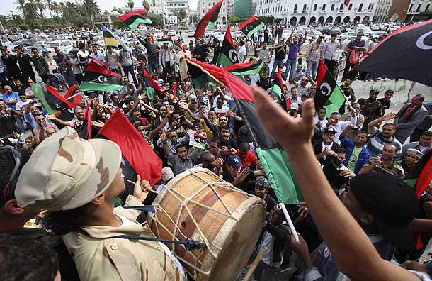 Libyans celebrate at Martyrs square in Tripoli after hearing the news that Libyan leader Gaddafi was killed in Sirte (Pic: Reuters)