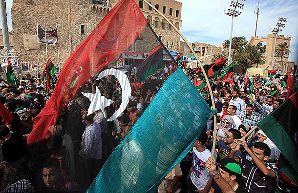 Libyans celebrate at Martyrs square in Tripoli after hearing the news that Libyan leader Gaddafi was killed in Sirte (Pic: Reuters)
