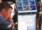 A trader works on the floor of the New York Stock Exchange as federal interest rates are announced in New York, June 23, 2010. REUTERS/Keith Bedford