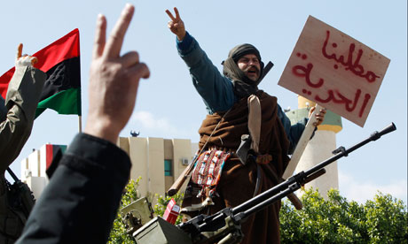 A man stands on a Libyan tank