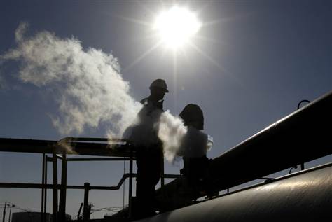 Image: Libyan oil worker, works at a refinery inside the Brega oil complex
