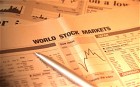 A newspaper with stock market figures on